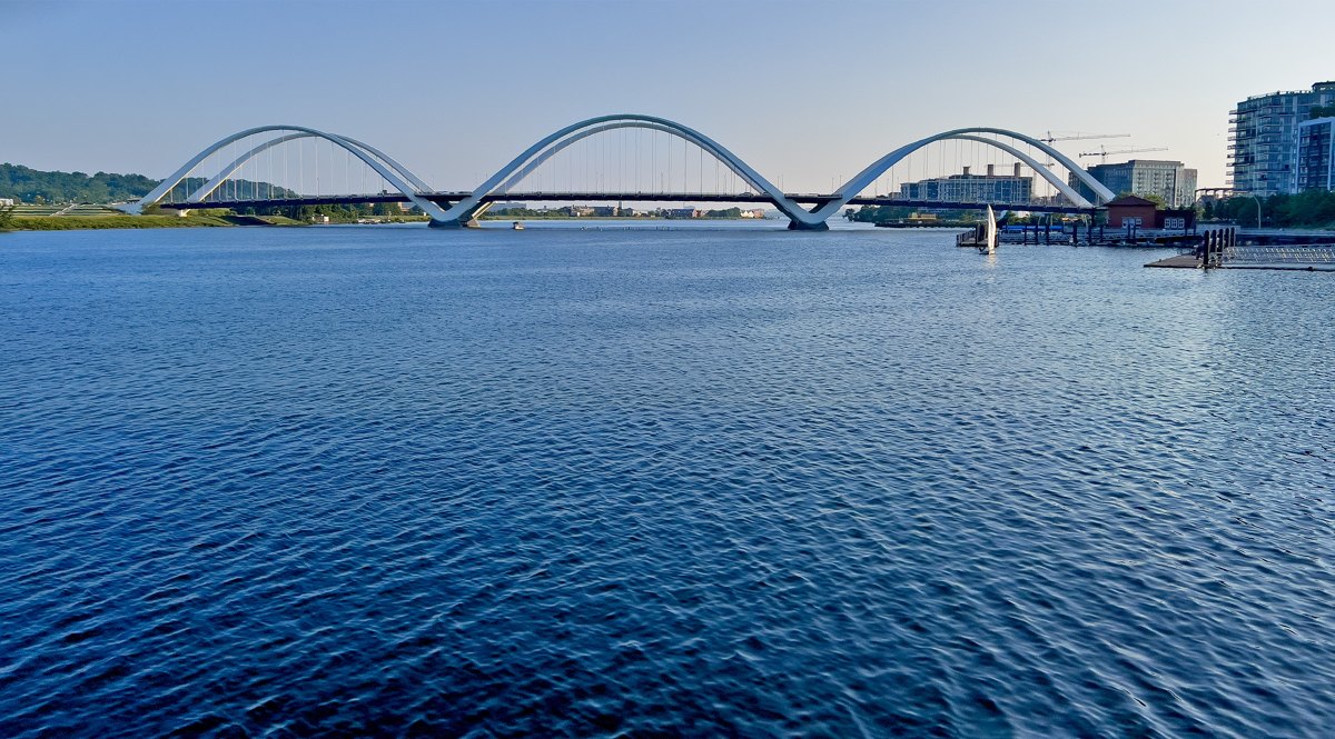 The Anacostia River and the arches of the Frederick Douglass Memorial Bridge.